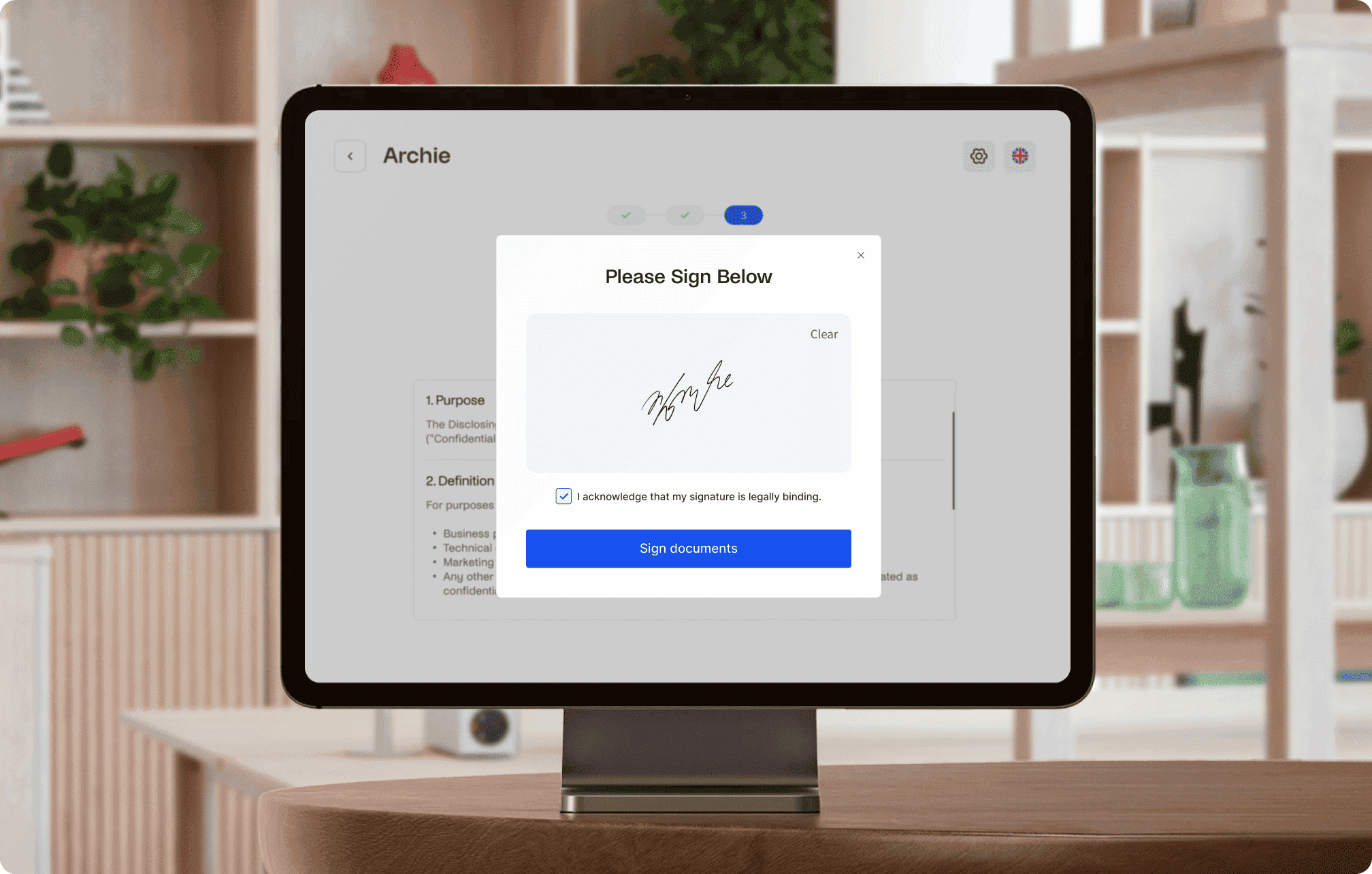 Tablet screen with Archie Visitors app displaying a document for signature with a signature field and a 'Sign documents' button.